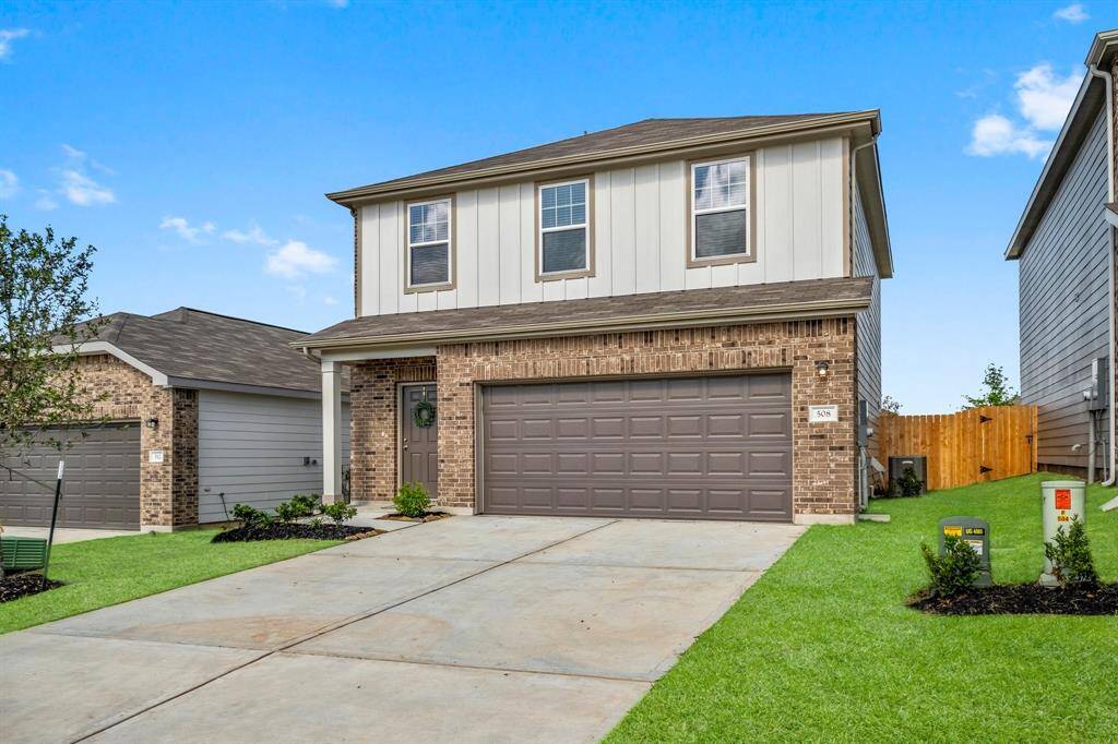 Lovely curb appeal with two car attached garage and double driveway.