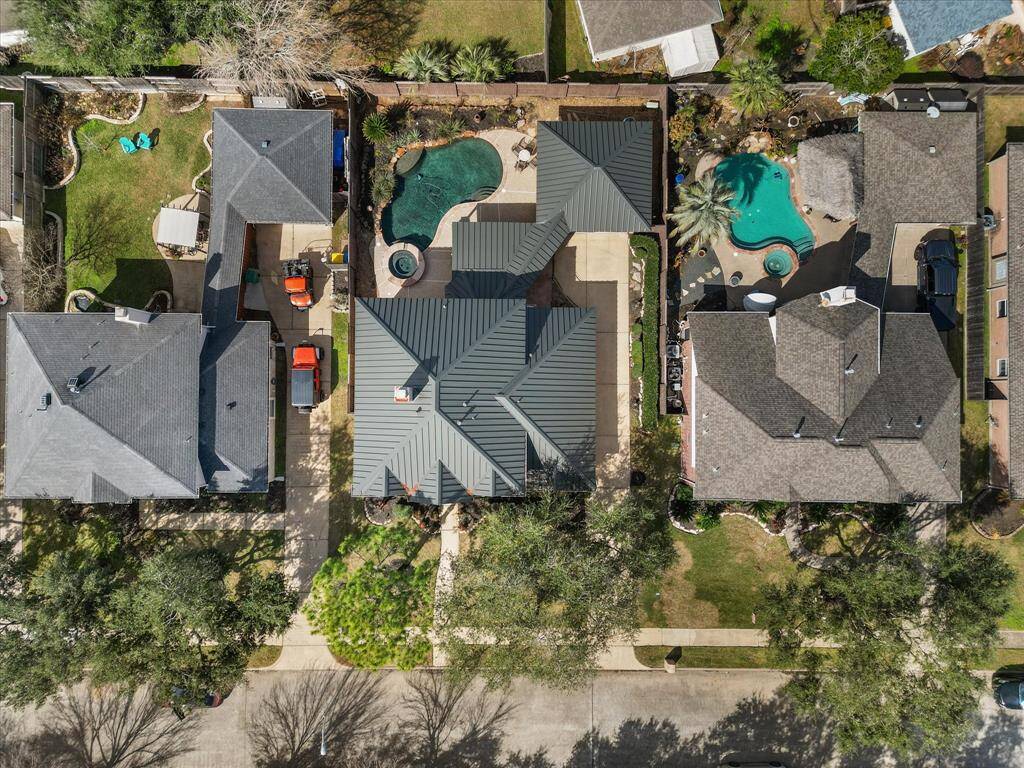 Overhead view showcasing the home's large lot and private pool.