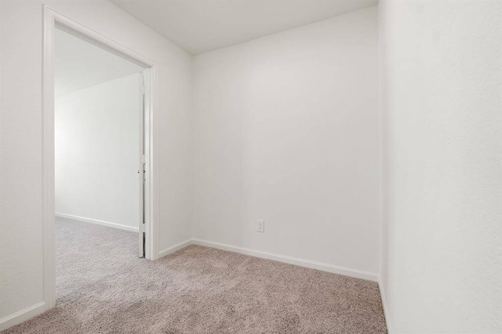This versatile landing at the top of the stairs offers an ideal space for a cozy desk, creating a productive home office environment or a small play area for kids!