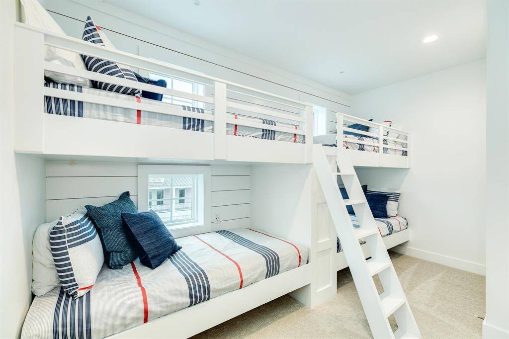 What a fun bunk room for the littles!  Each bunk has it's own reading light and plugs for all the electronics.