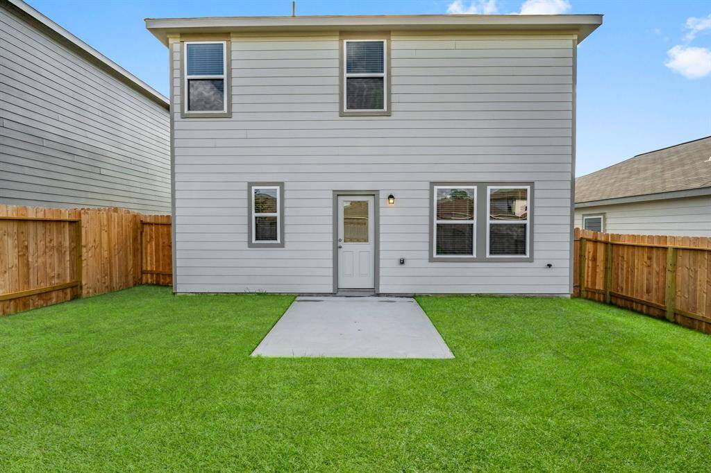A view of the back of the home and patio.