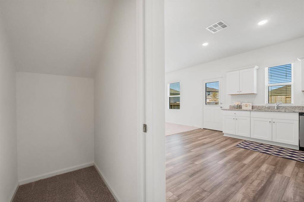 The ultimate convenience in your kitchen is this a spacious storage closet located just across from the pantry.