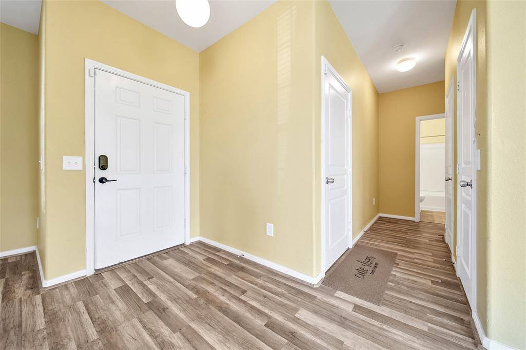 Front hall leads to a full bath and bedroom down.