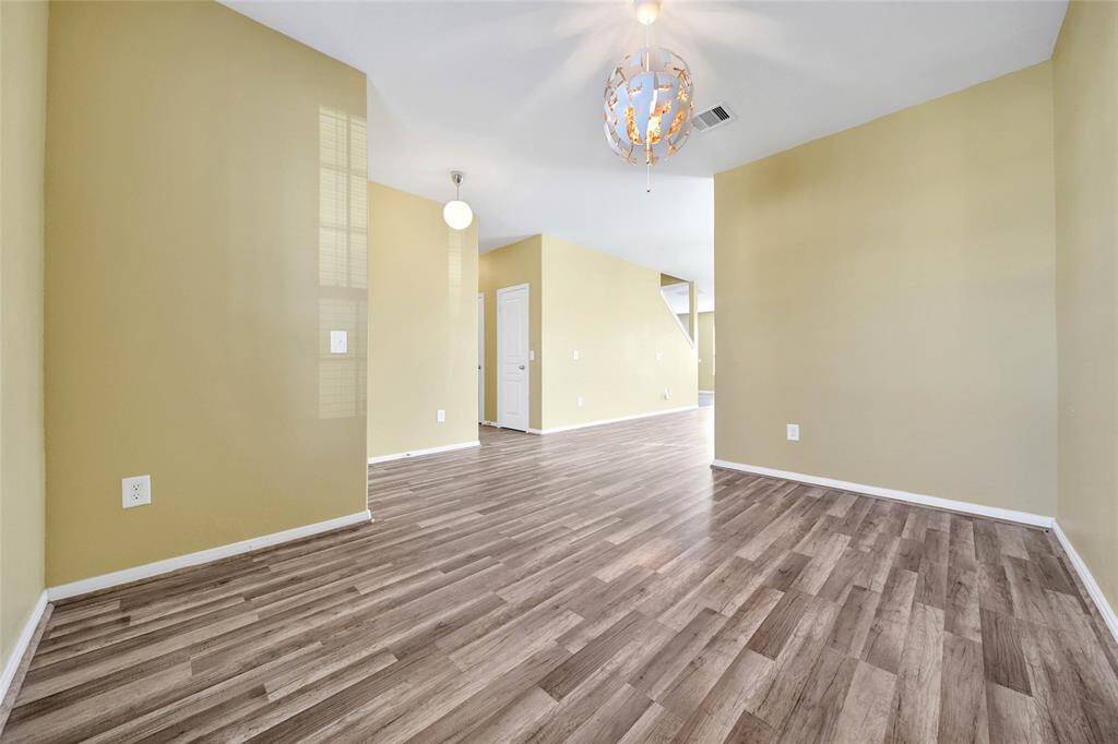 Undated flooring flows from the front of the home to the back.