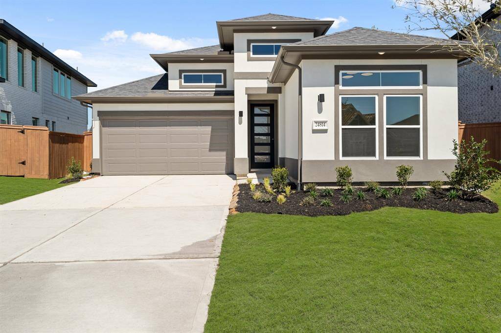 Pointed vaulted ceiling defines family room and covered patio.