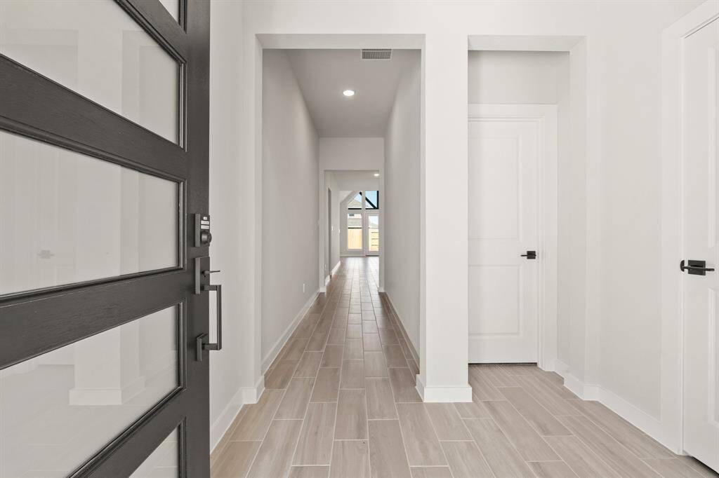 The Modern Elevation for the FRANKLIN PLAN BY NEWMARK HOMES offers sleek lines, contemporary design elements, and chic finishes that redefine modern living.