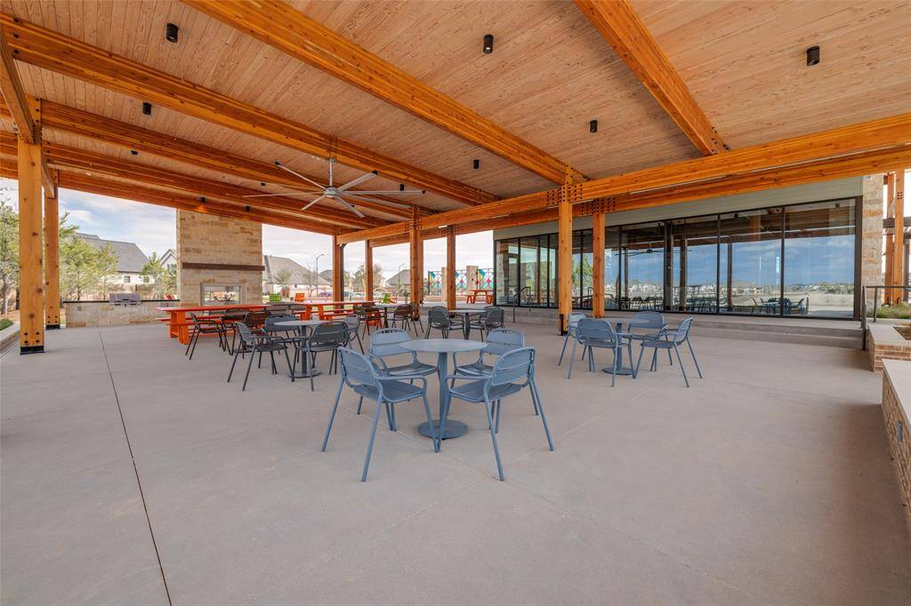 The Lakeside Landing patio area offers a serene retreat with breathtaking views of the water, perfect for relaxation and outdoor gatherings. Featuring comfortable seating and stylish décor, it blends natural beauty with modern design for an ideal lakeside escape.