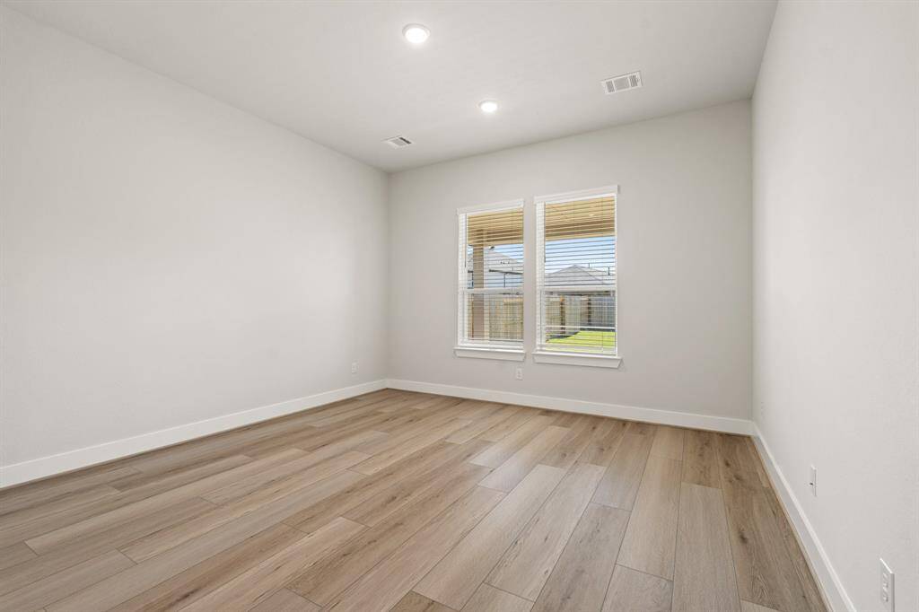 Main bedroom features hardwood floors.