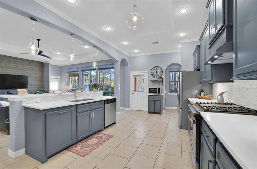 This spectacular kitchen includes updated appliances, plenty of cabinets and spacious countertops.