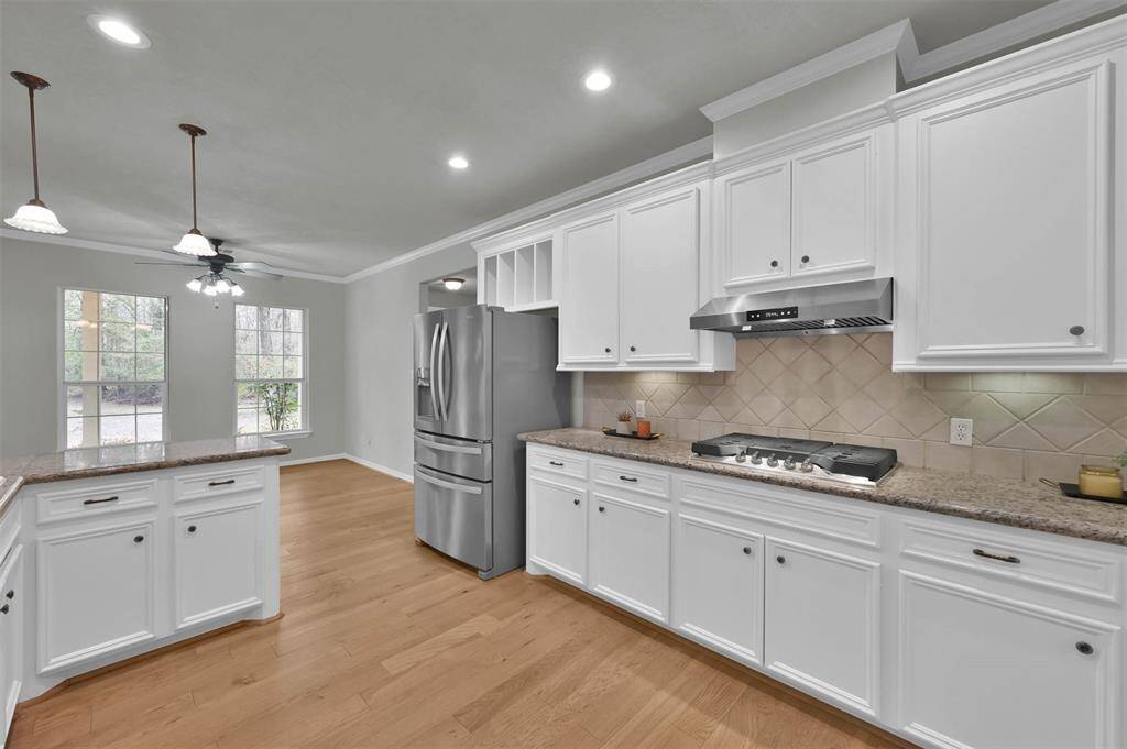Kitchen seamlessly flows into a welcoming breakfast area.