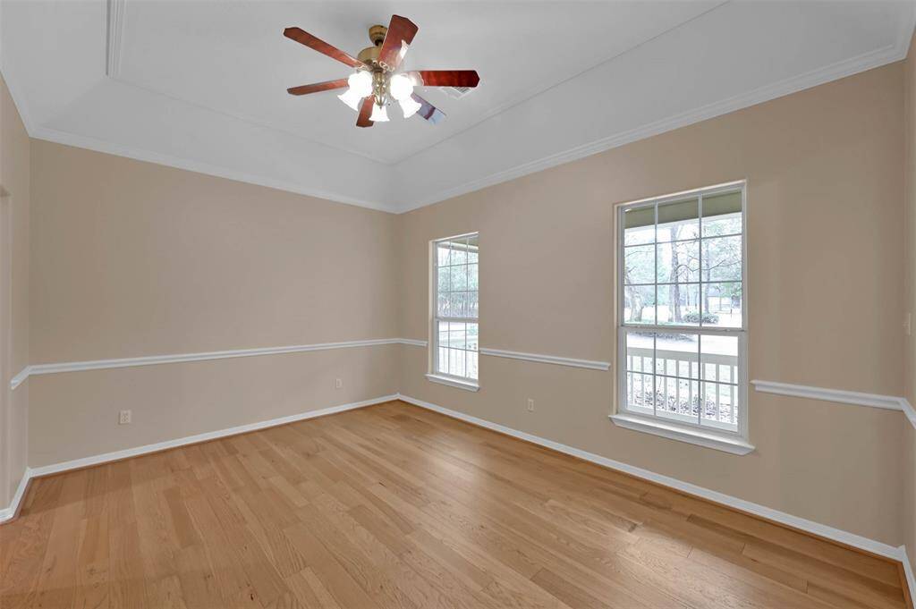 Formal dining area with abundant natural light.