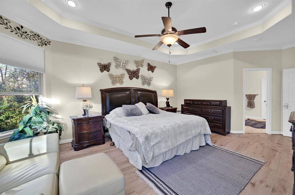 There is plenty of room to add a sitting area by the windows overlooking the backyard oasis.
