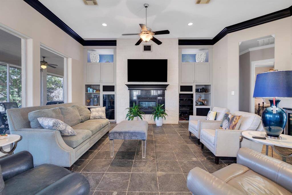 Living area incudes custom built-ins, Fireplace and wet bar.
