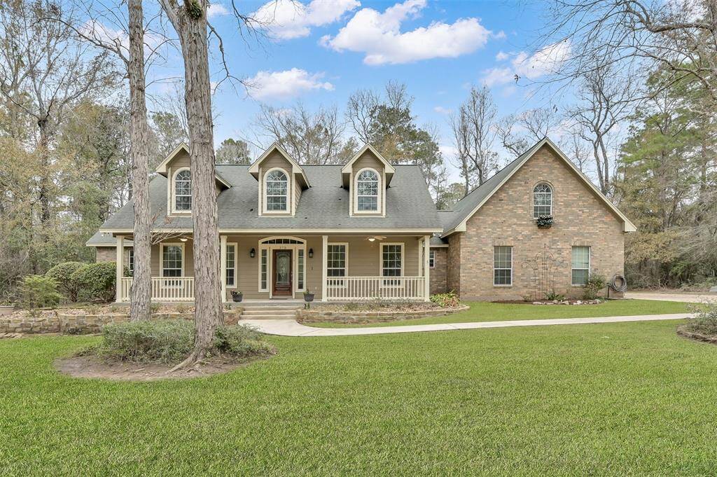 Discover your dream home at Ridge Lake Shores! This stunning custom-built residence sits on a sprawling 2-acre lot, offering privacy and elegance.