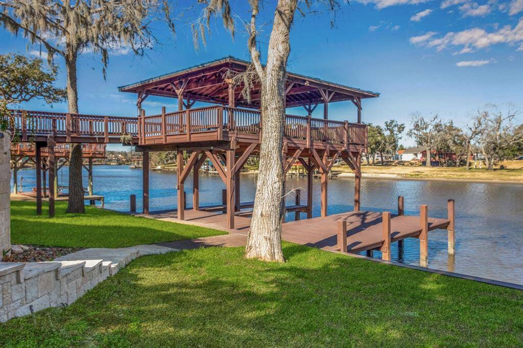 Spectacular recently renovated double decker boat dock and recently replaced bulkheading, with large covered upper deck for entertaining.