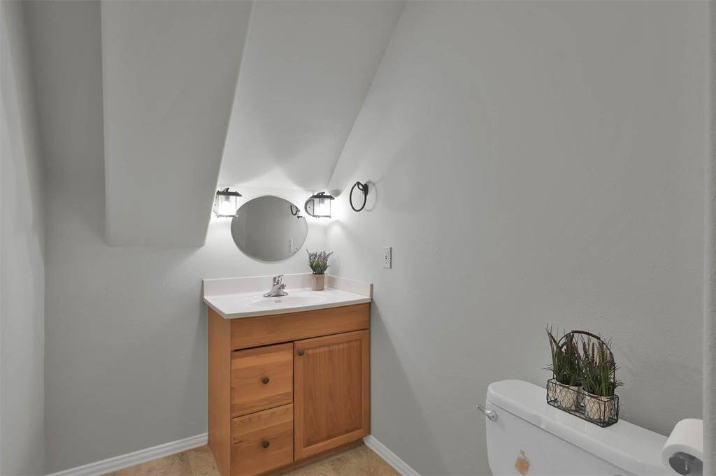 Conveniently located upstairs, this half bath adds functionality and charm.