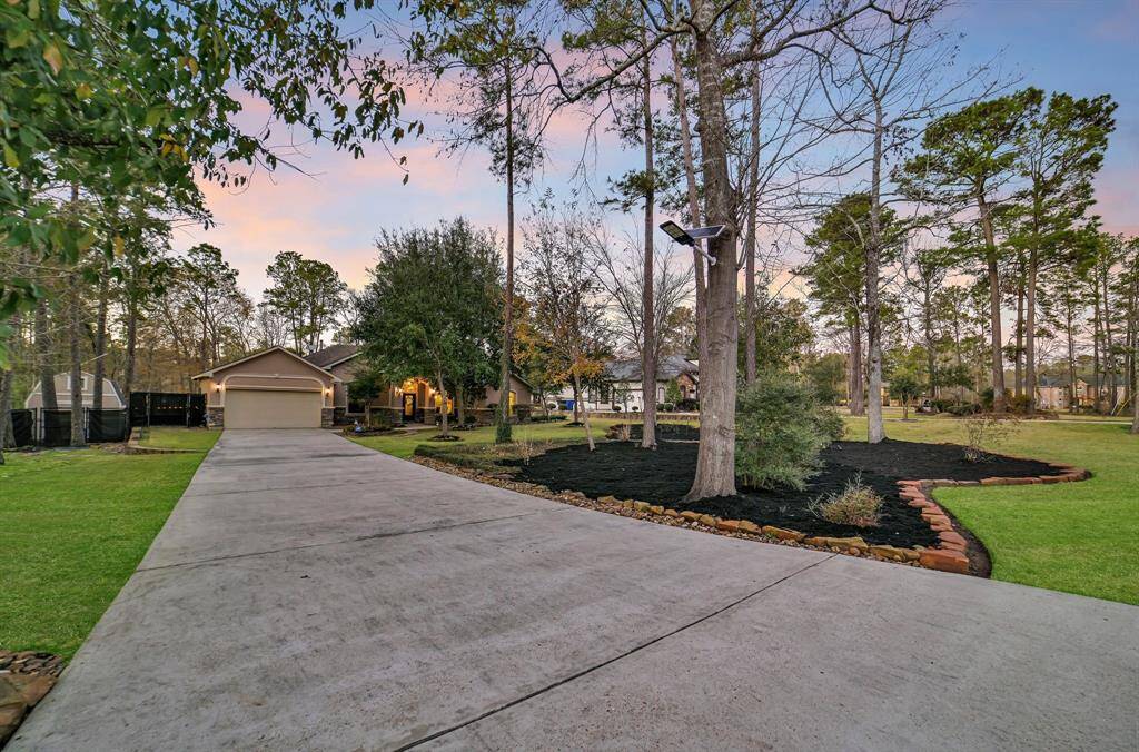 This stunning home includes a long driveway surrounded by a lush, well-maintained garden with delightful stone borders making parking easy for family get-togethers or entertaining your guests.