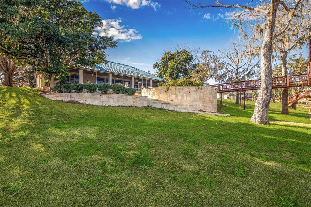 View of Back of house and stone retaining wall