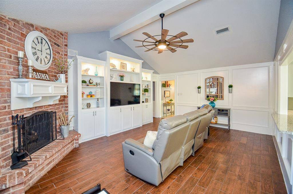 The fireplace & built in's are the focal point of the den.