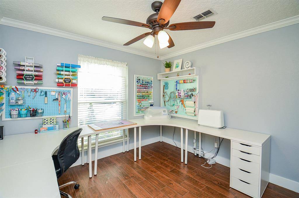 One of the secondary bedrooms is used as a hobby area.
