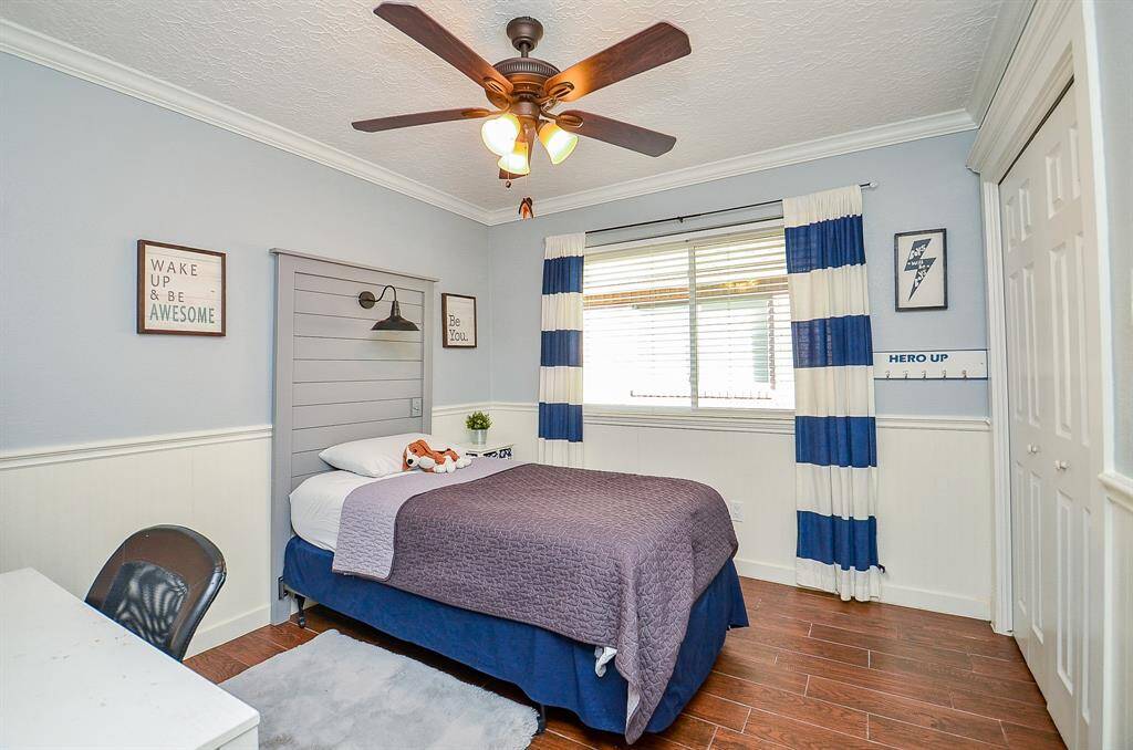 Another secondary bedroom with crown molding & lots of closet space.