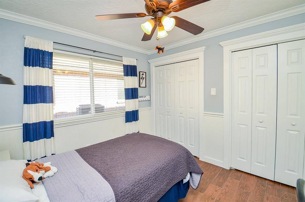 This secondary bedroom features lots of closet space.