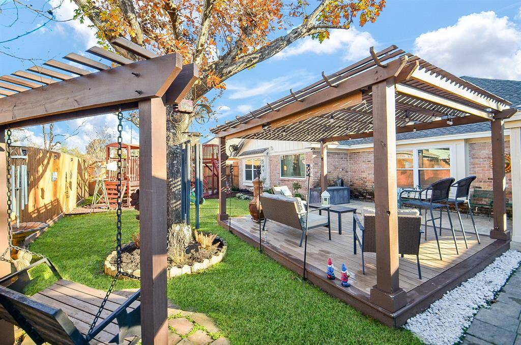 The pergola area is a great spot for a Texas BBQ.