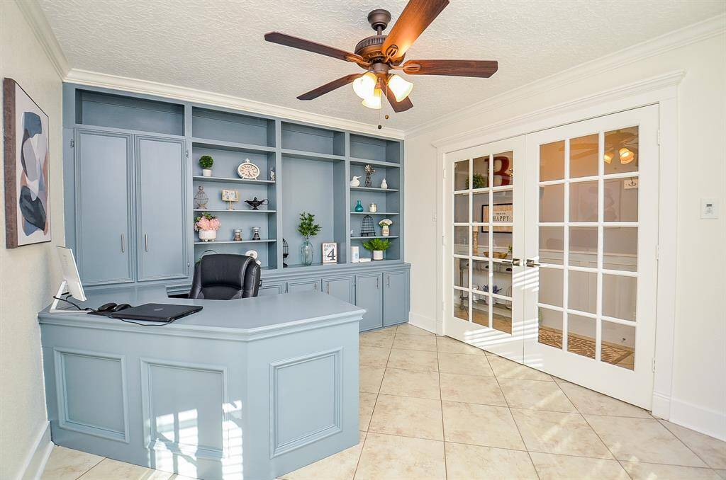 More of the private study with beautiful french  doors & elegant crown molding.