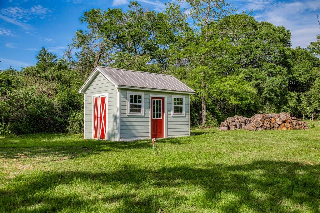 A perfectly placed water well house with plenty of extra space for storage.
