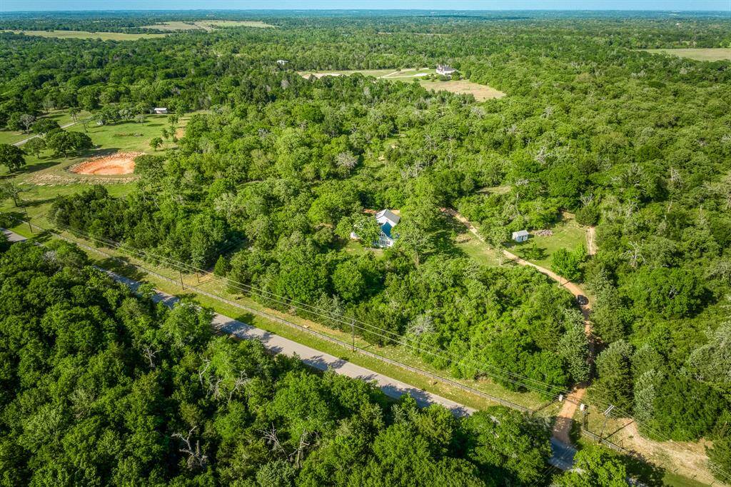 Aerial view overlooking Hinkel Rd and the true privacy this property offers.