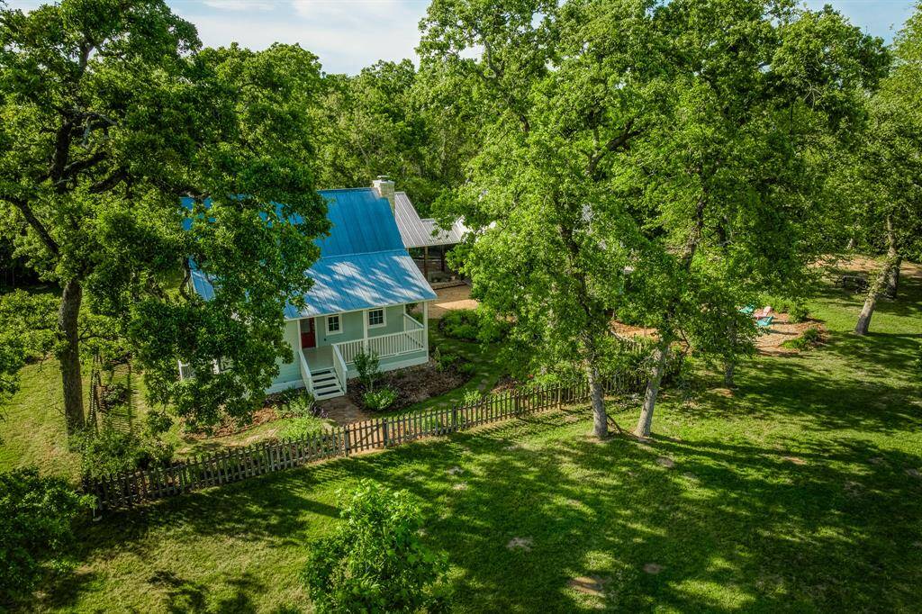 Green landscaping that's full and lush brings out the natural beauty of this property.