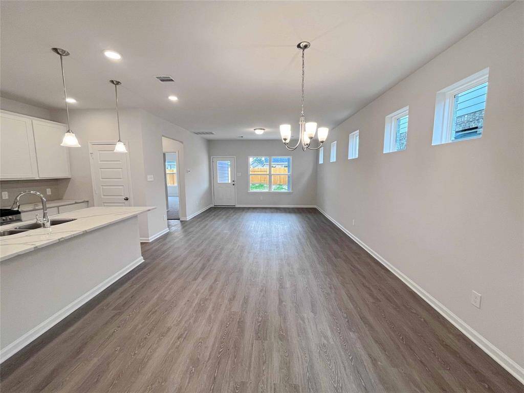 The Robin II- Dining Area into Family Room . Sample photo used for illustrative purposes only, options/colors will vary.