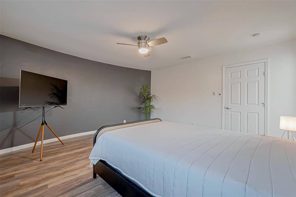 Stylish primary bath featuring double sinks, a walk-in shower, and plenty of storage.