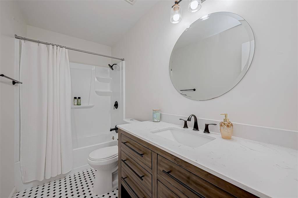 Well-appointed secondary bath with a tub/shower combo for added convenience.