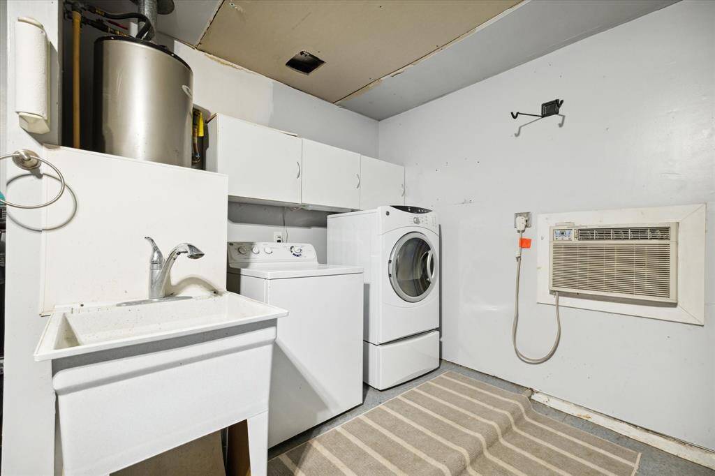 The garage has a dedicated utility space with a walk-unit air conditioner