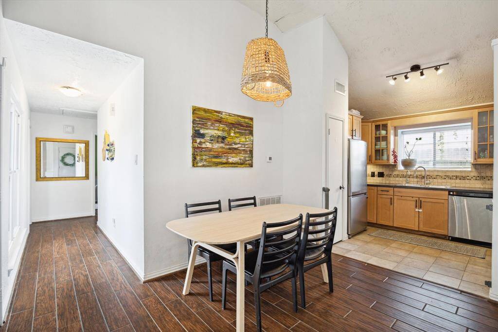 Off the living room is the dining area and kitchen with plenty of room to seat 6