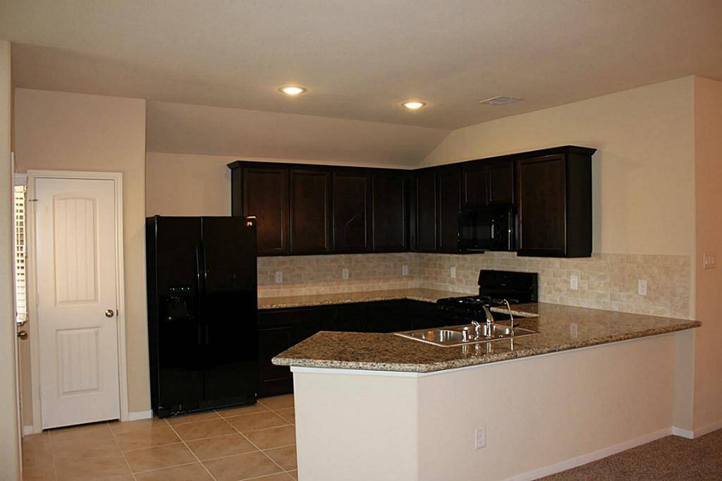 Super nice kitchen with granite counters. Refrigerator included