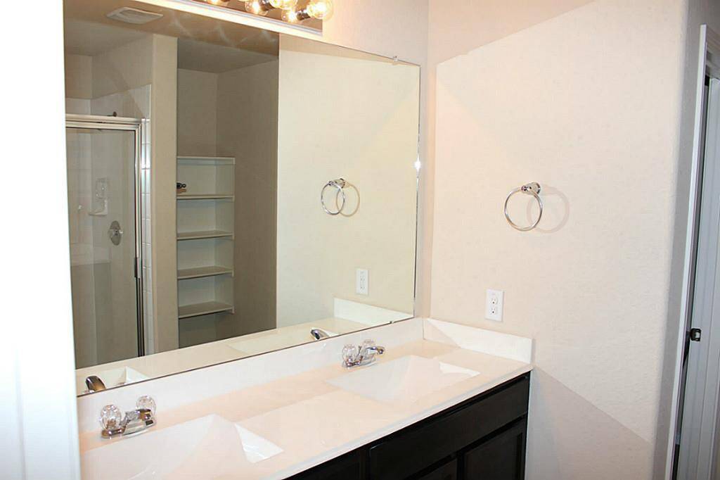 Another view of master bathroom with built-in shelving