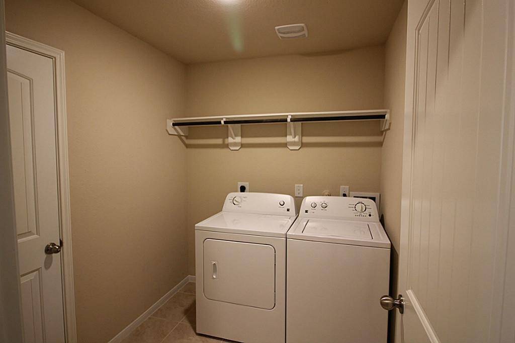 Laundry room with washer and dryer included