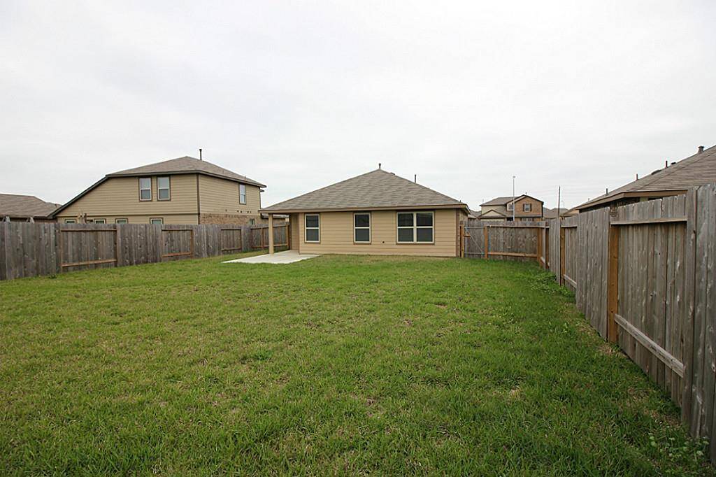 View of back elevation and large backyard