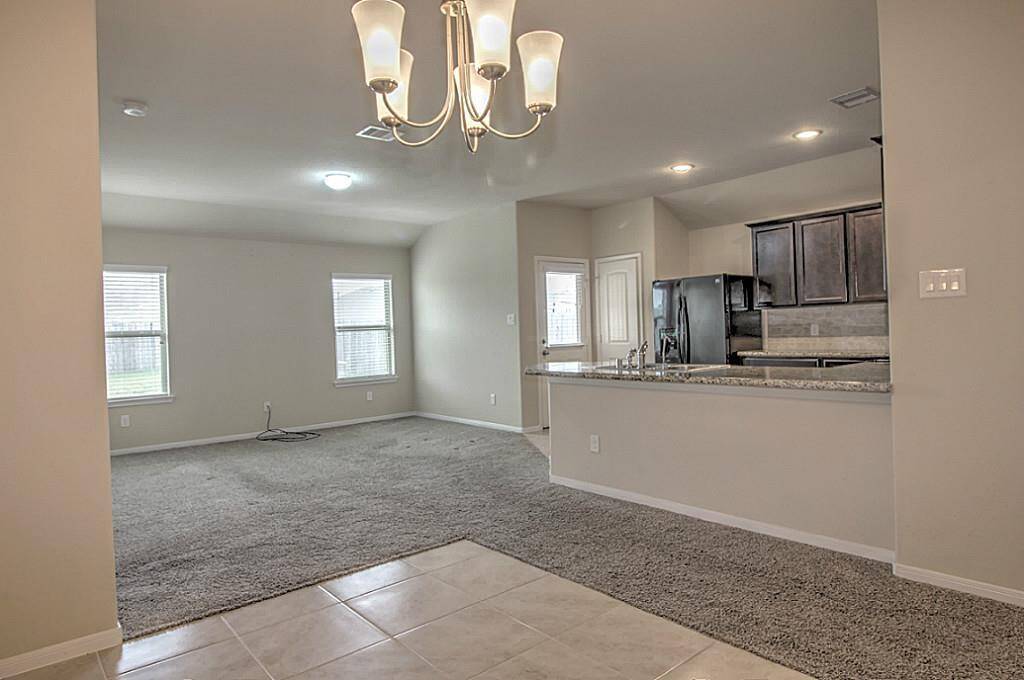 Overview of formal dining, living room and kitchen