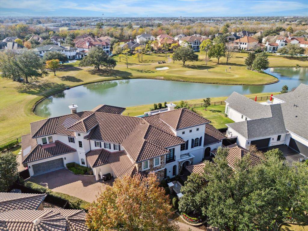 Back exterior view. Beautiful pool, spa, entertaining space, multiple covered lanais, outdoor fireplace, kitchen and bar.