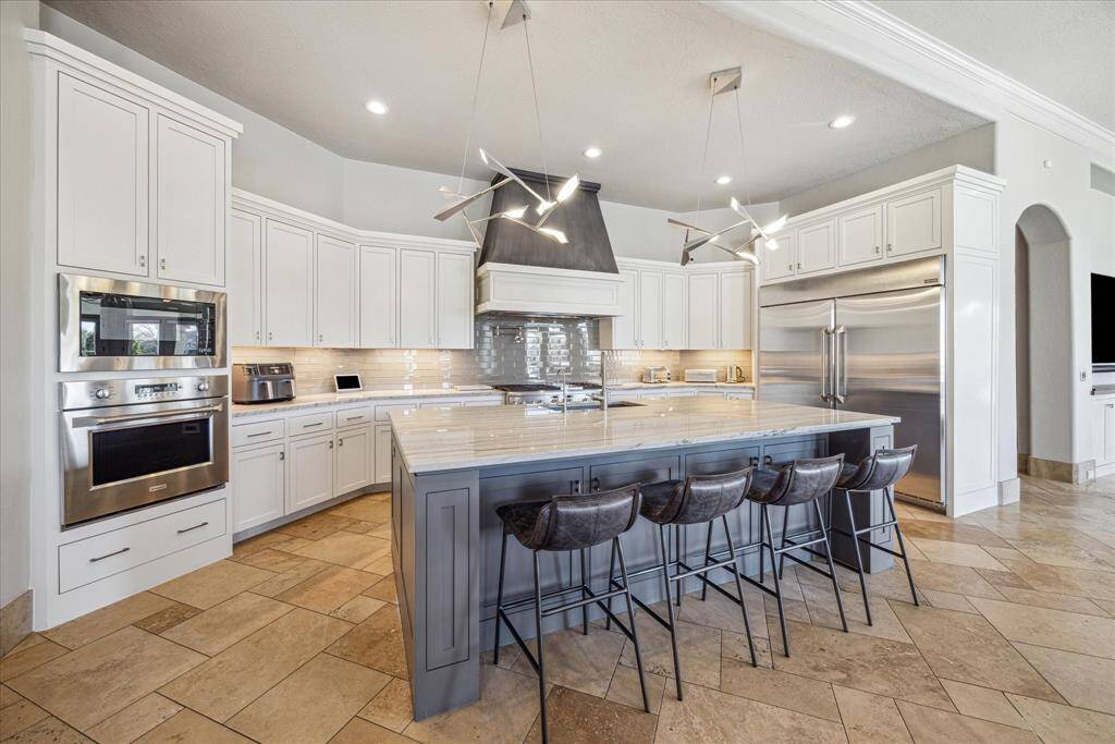 Remodeled kitchen  with full size side by side refrigerator and freezer. Walk in pantry, and plenty of storage.