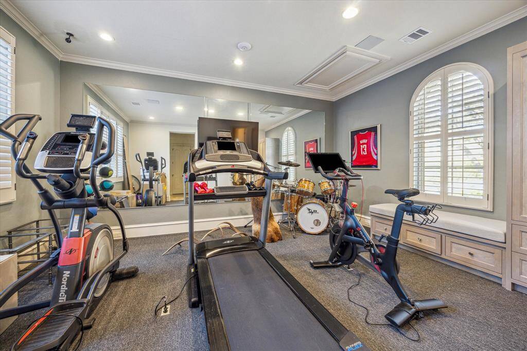 Casita currently used as an exercise room, with kitchen area, bathroom and closet. Can easily function as quarters or the 6th bedroom.