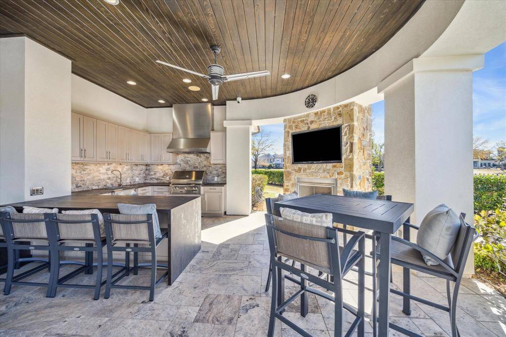 One of several outdoor covered areas. Fireplace, TV, outdoor kitchen and plenty of seating