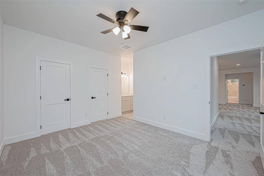 secondary bedroom upstairs with its own private sink area