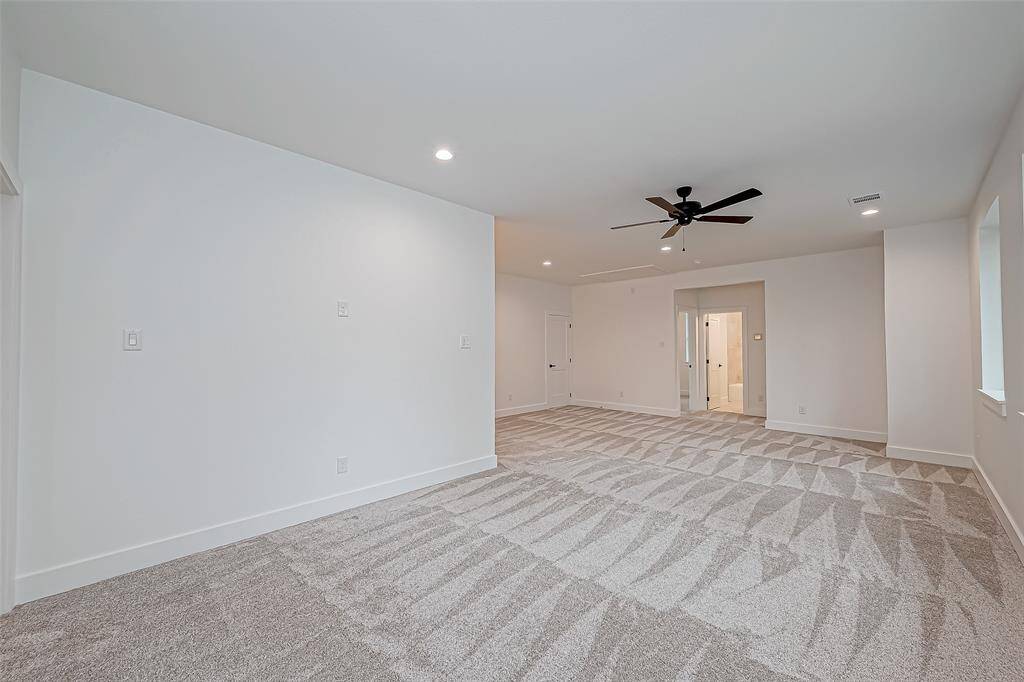 game room looking at bath with 2 bedrooms next to it