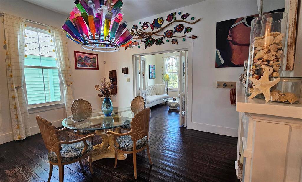 Dining Room has Natural lighting from the Custom Windows. The Chandelier is surely a conversation piece!