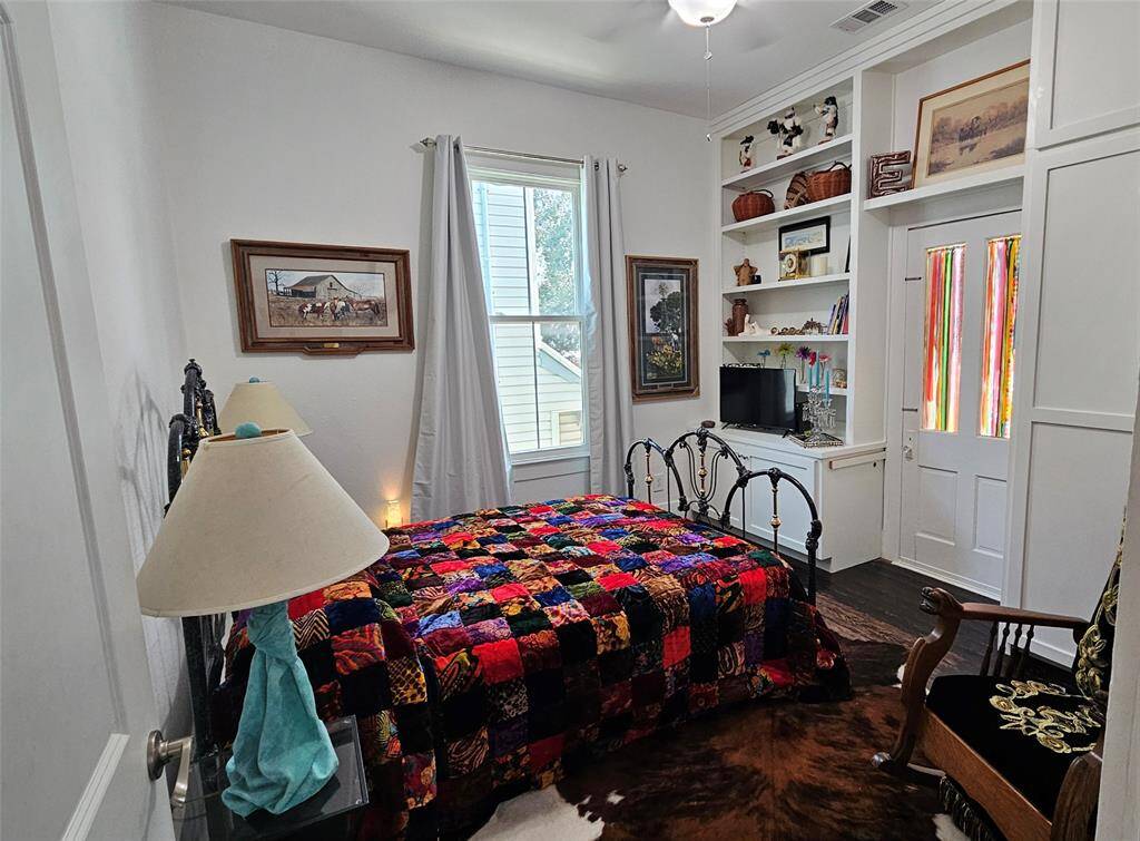 Middle Bedroom with High Ceilings, Built in shelving and closet! The door leads to the Balcony!