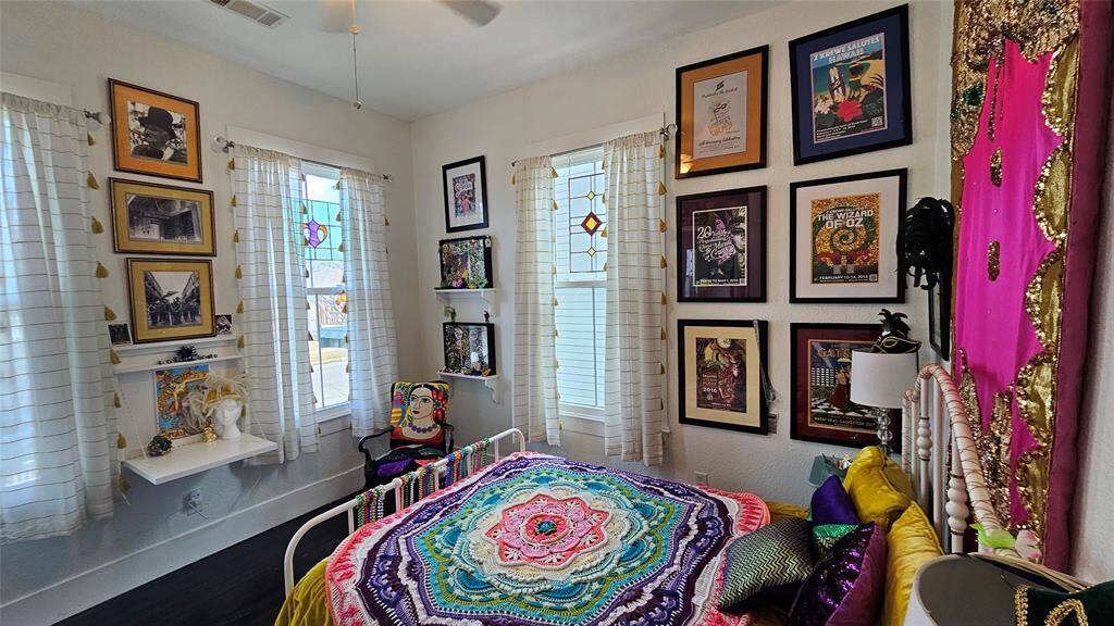 3rd Bedroom with high ceilings, natural light in the "Mardi Gras" Room!!